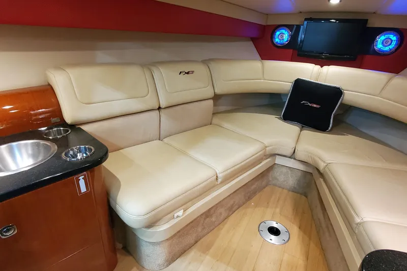  Yacht Photos Pics Luxurious interior of 2011 Formula 310 FX5 Bowrider with plush seating and entertainment system.