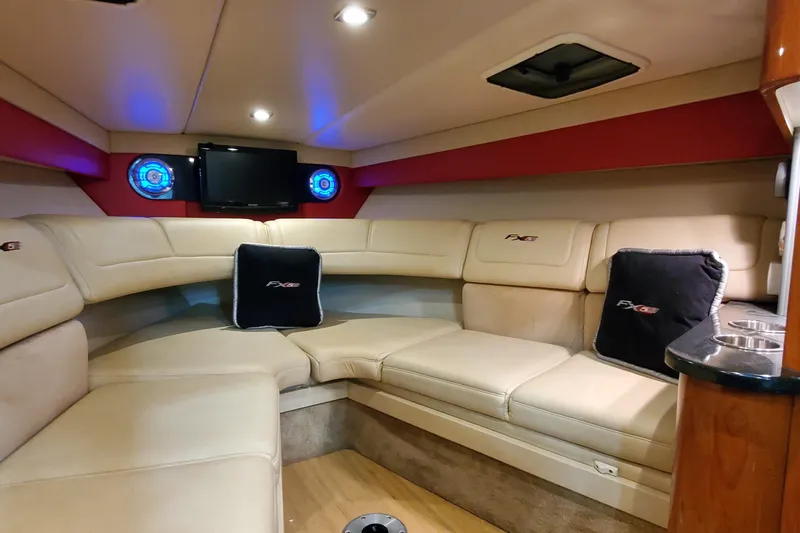  Yacht Photos Pics Luxurious interior of 2011 Formula 310 FX5 Bowrider with plush seating and entertainment system.