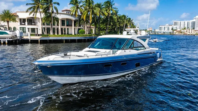  Yacht Photos Pics 2019 Formula 430 All Sport Crossover boat cruising near waterfront homes.