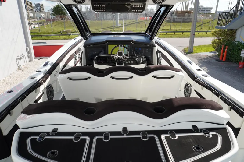  Yacht Photos Pics Luxury MTI V42 boat interior with sleek seating and modern dashboard, 2021 model.