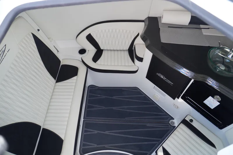  Yacht Photos Pics Luxurious interior of 2021 MTI V42 boat with sleek black and white seating.