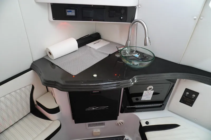  Yacht Photos Pics Luxurious MTI V42 2021 boat interior with sleek kitchenette and modern amenities.