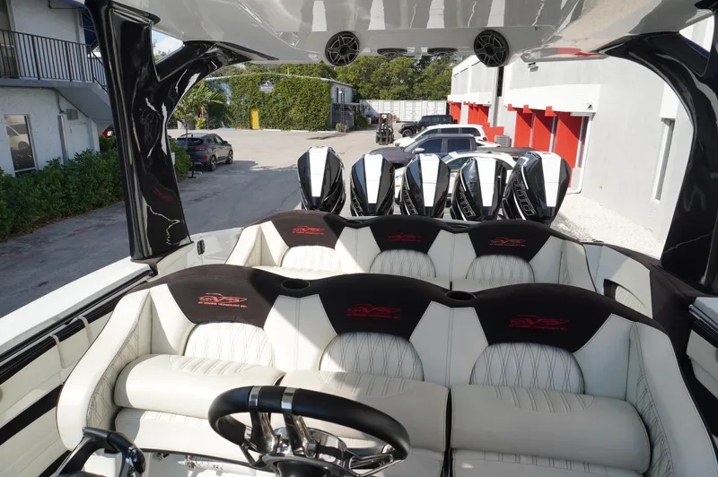  Yacht Photos Pics Luxurious 2021 MTI V42 boat interior with plush seating and multiple engines.