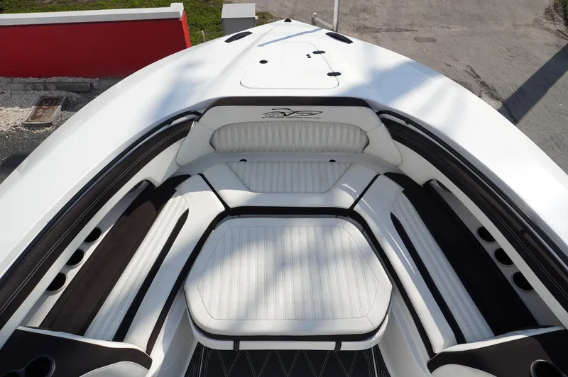  Yacht Photos Pics 2021 MTI V42 boat interior with white and black seating, sleek design.