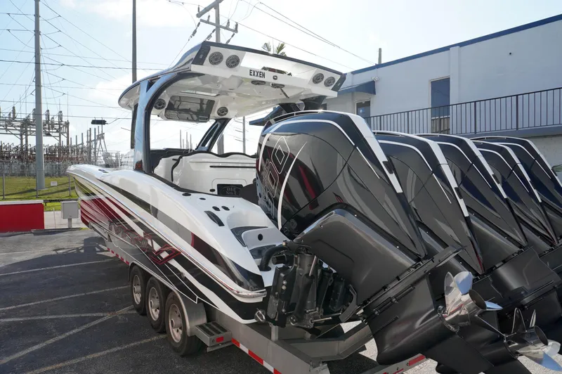  Yacht Photos Pics 2021 MTI V42 boat with multiple powerful outboard engines on a trailer.