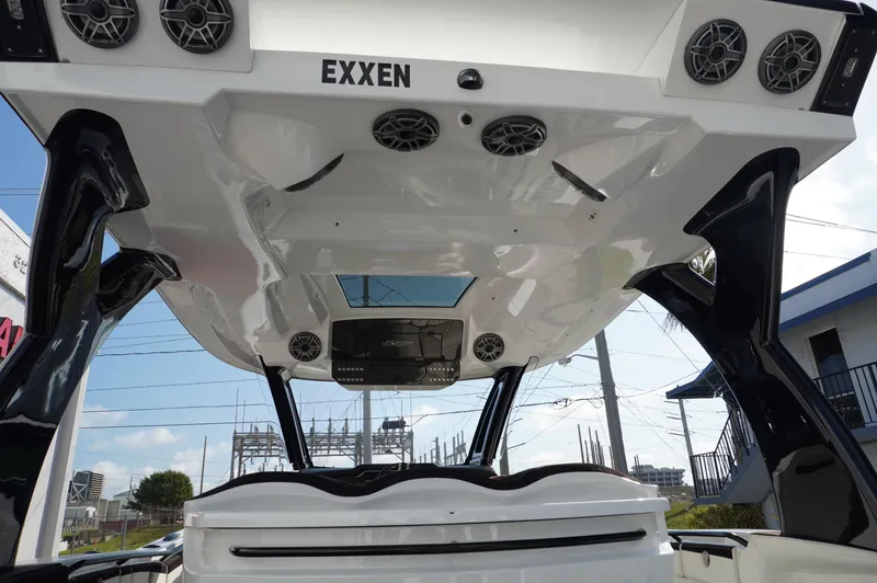  Yacht Photos Pics 2021 MTI V42 boat with advanced audio system and sleek design, viewed from below.