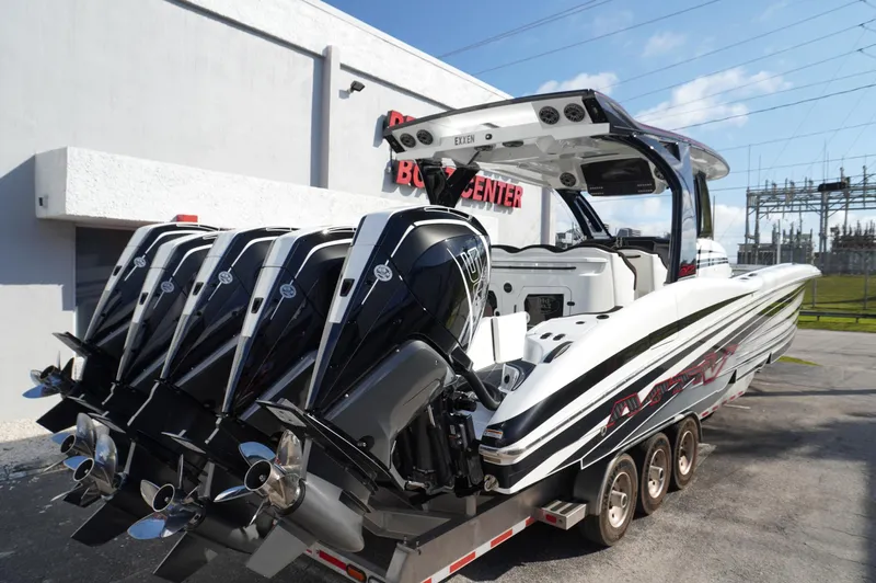  Yacht Photos Pics 2021 MTI V42 boat with four powerful outboard engines on a trailer.