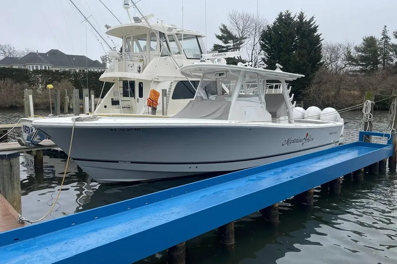  Yacht Photos Pics 2024 Regulator 37 boat docked, featuring sleek design and modern amenities.