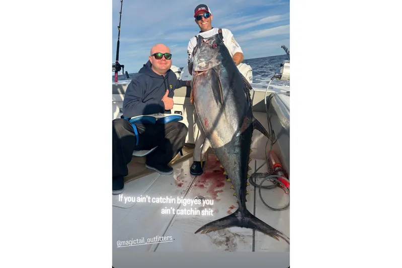  Yacht Photos Pics Two people on a 2024 Regulator 37 boat with a large tuna catch.