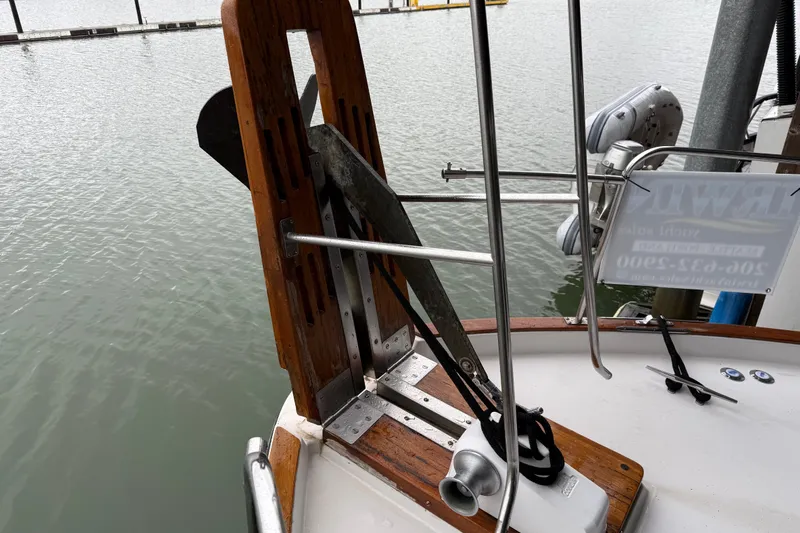 Lady Jake Yacht Photos Pics 1985 Bayliner 4550 Motoryacht anchor system on deck by the water.