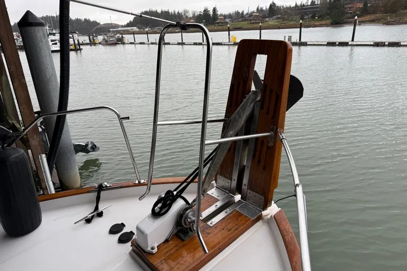 Lady Jake Yacht Photos Pics 1985 Bayliner 4550 Motoryacht anchor system at dockside, with calm water and marina view.