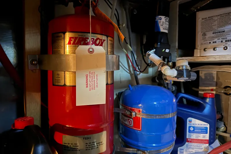 Lady Jake Yacht Photos Pics Engine room of 1985 Bayliner 4550 Motoryacht with fire extinguisher and equipment.