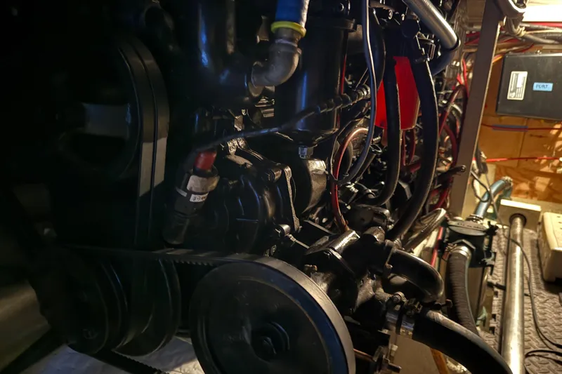 Lady Jake Yacht Photos Pics Engine room of 1985 Bayliner 4550 Motoryacht, showcasing mechanical components and wiring.