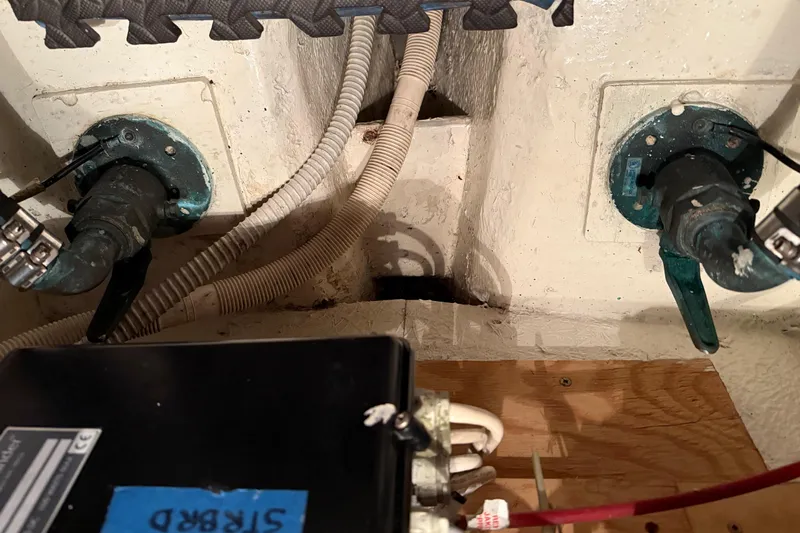 Lady Jake Yacht Photos Pics Engine room of 1985 Bayliner 4550 Motoryacht showing pipes and electrical components.