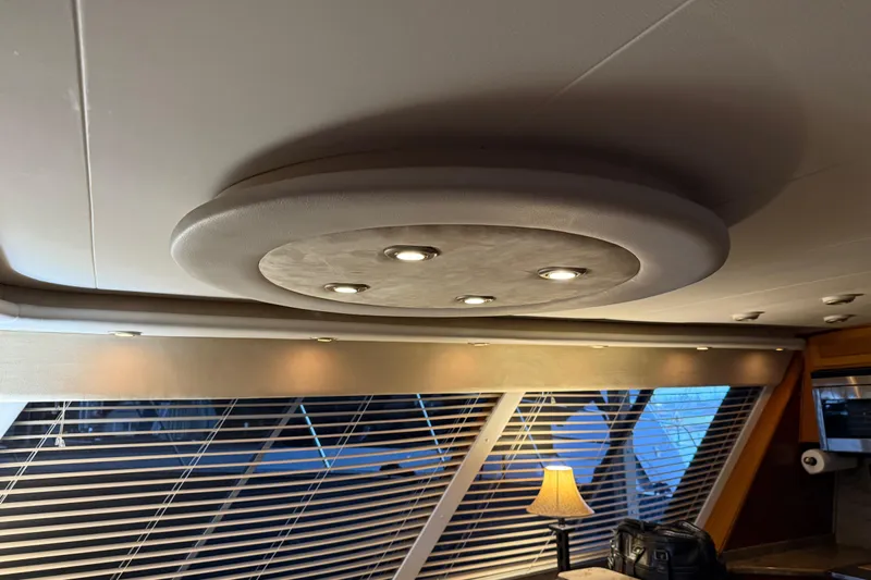 Lady Jake Yacht Photos Pics Interior of 1985 Bayliner 4550 Motoryacht with modern ceiling lights and window blinds.