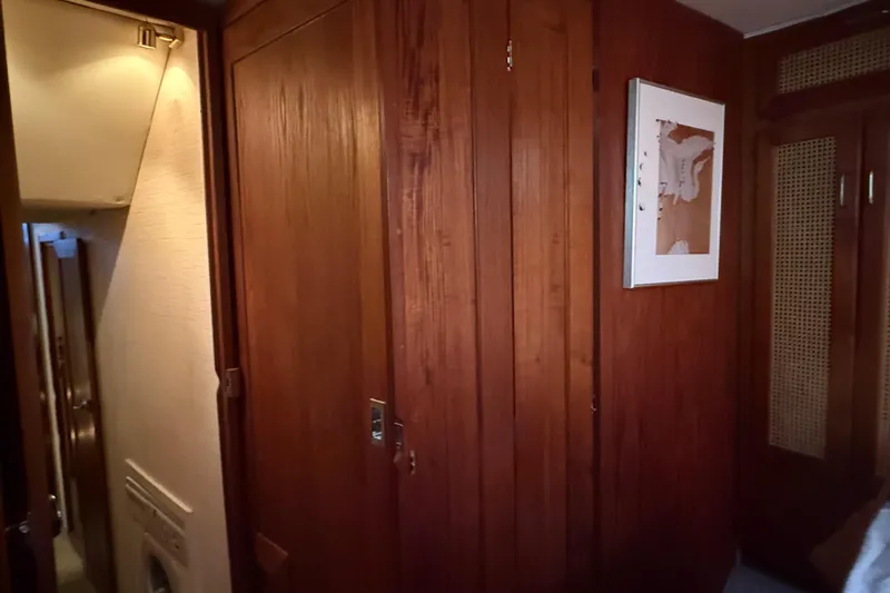 Lady Jake Yacht Photos Pics Interior of 1985 Bayliner 4550 Motoryacht with wooden paneling and framed artwork.