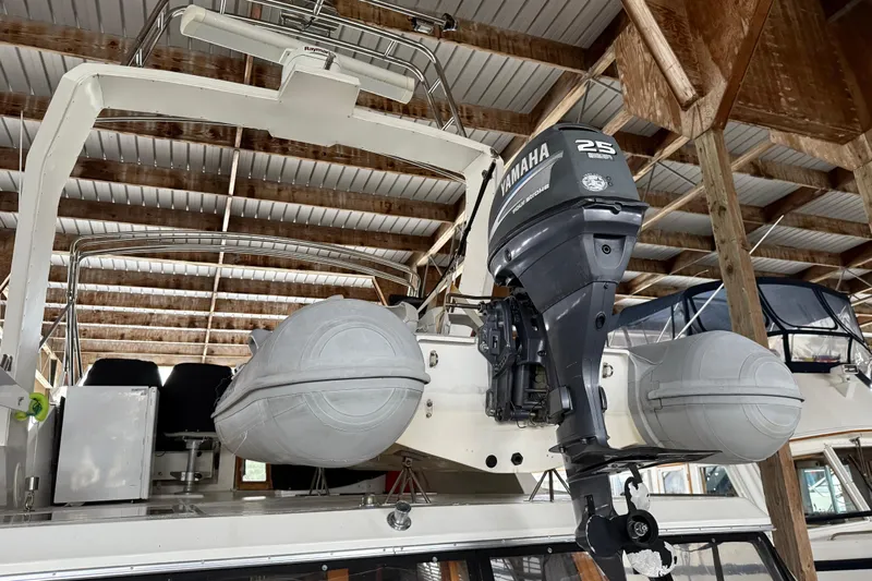 Lady Jake Yacht Photos Pics 1985 Bayliner 4550 Motoryacht with Yamaha 25 outboard motor in a boathouse.