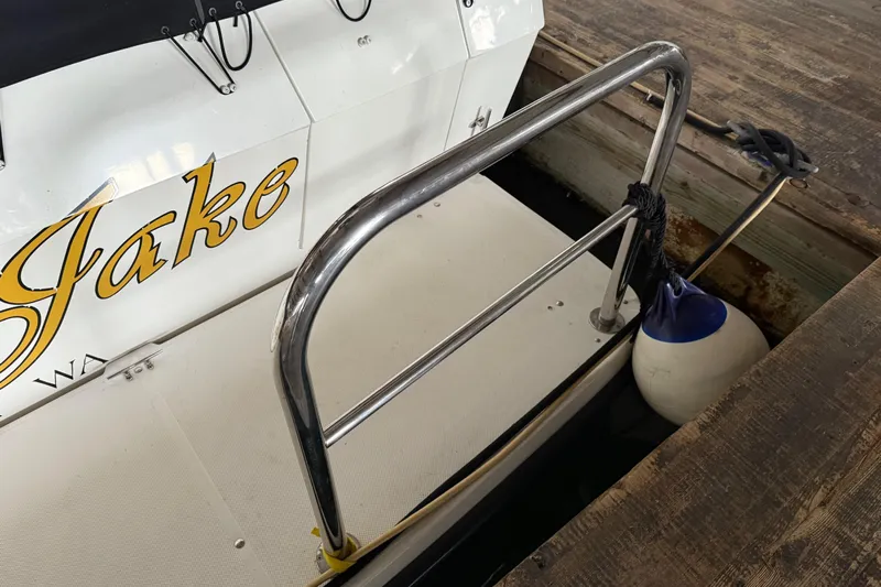 Lady Jake Yacht Photos Pics 1985 Bayliner 4550 Motoryacht docked, featuring a metal railing