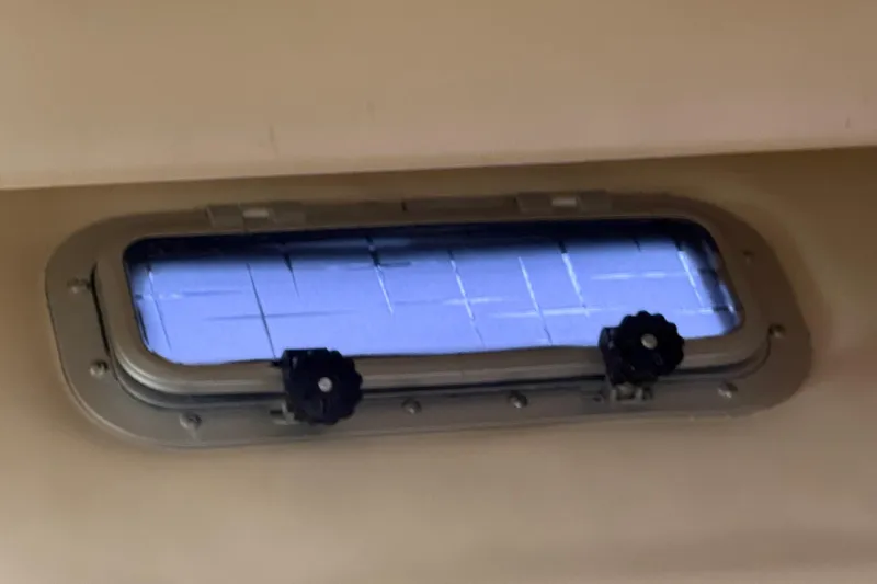 Lady Jake Yacht Photos Pics Porthole window on 1985 Bayliner 4550 Motoryacht, showcasing exterior view.