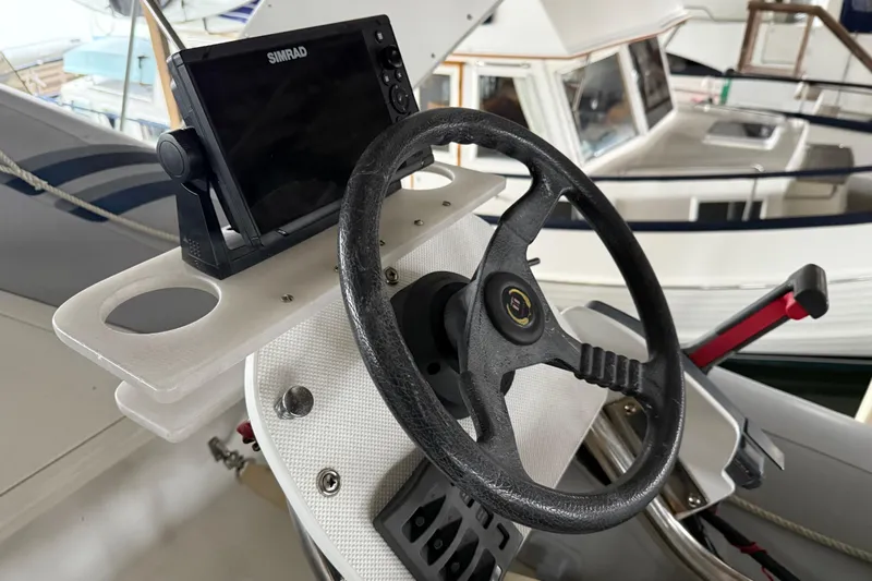 Lady Jake Yacht Photos Pics Steering wheel and navigation system on 1985 Bayliner 4550 Motoryacht.