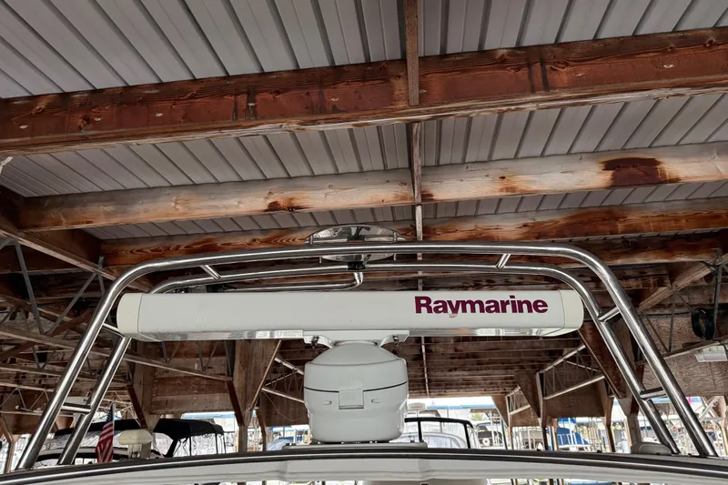 Lady Jake Yacht Photos Pics 1985 Bayliner 4550 Motoryacht with Raymarine radar under a wooden dock roof.