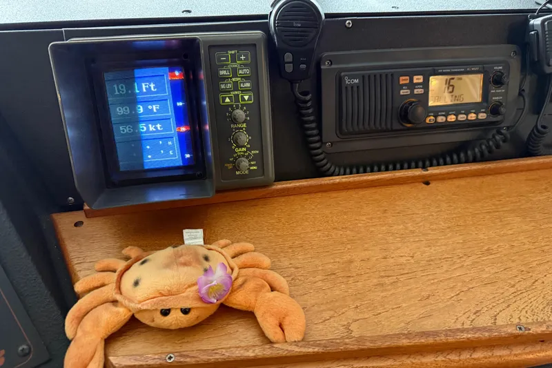 Lady Jake Yacht Photos Pics Control panel of a 1985 Bayliner 4550 Motoryacht with plush crab decoration.