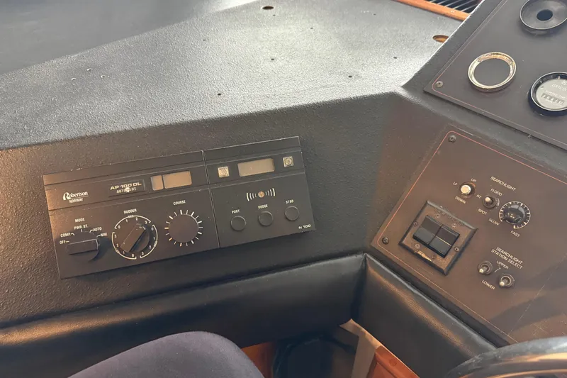 Lady Jake Yacht Photos Pics Control panel of a 1985 Bayliner 4550 Motoryacht with autopilot and searchlight controls.