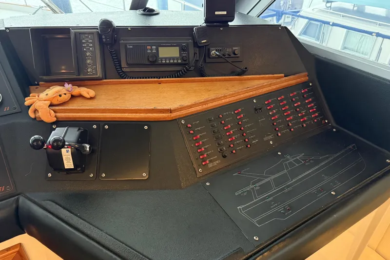 Lady Jake Yacht Photos Pics 1985 Bayliner 4550 Motoryacht helm with control panel and marine electronics.