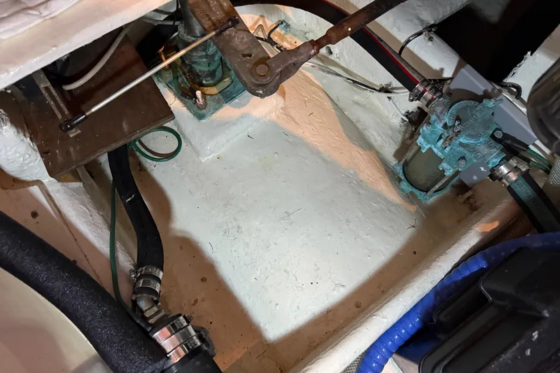 Lady Jake Yacht Photos Pics Engine compartment of a 1985 Bayliner 4550 Motoryacht showing mechanical components and hoses.