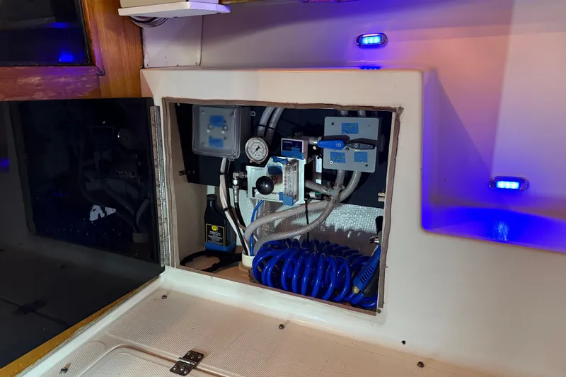 Lady Jake Yacht Photos Pics Electrical panel inside 1985 Bayliner 4550 Motoryacht with blue LED lighting.