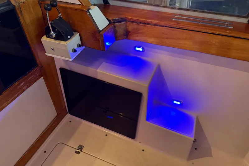 Lady Jake Yacht Photos Pics 1985 Bayliner 4550 Motoryacht interior with control panel and blue LED lighting.