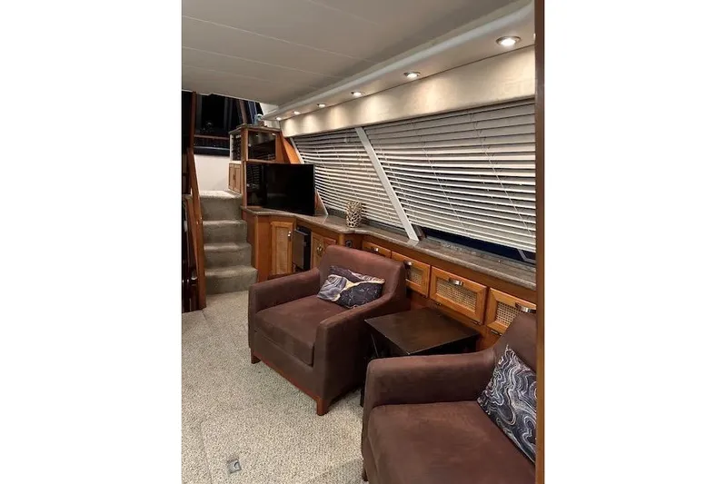 Lady Jake Yacht Photos Pics Interior of 1985 Bayliner 4550 Motoryacht with cozy seating and modern decor.