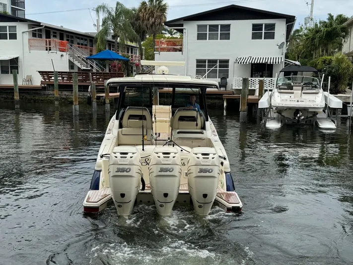  Yacht Photos Pics 2022 Chris-Craft CALYPSO 35 CP boat with triple 350 engines in a canal setting.