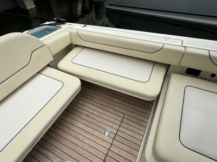  Yacht Photos Pics Luxurious seating on 2022 Chris-Craft CALYPSO 35 CP boat with teak flooring.
