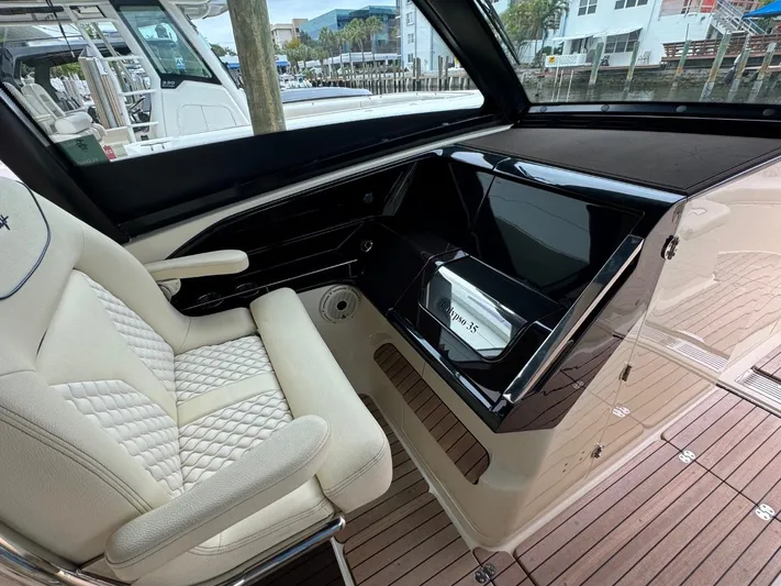  Yacht Photos Pics Luxurious interior of 2022 Chris-Craft CALYPSO 35 CP with plush seating and sleek dashboard.