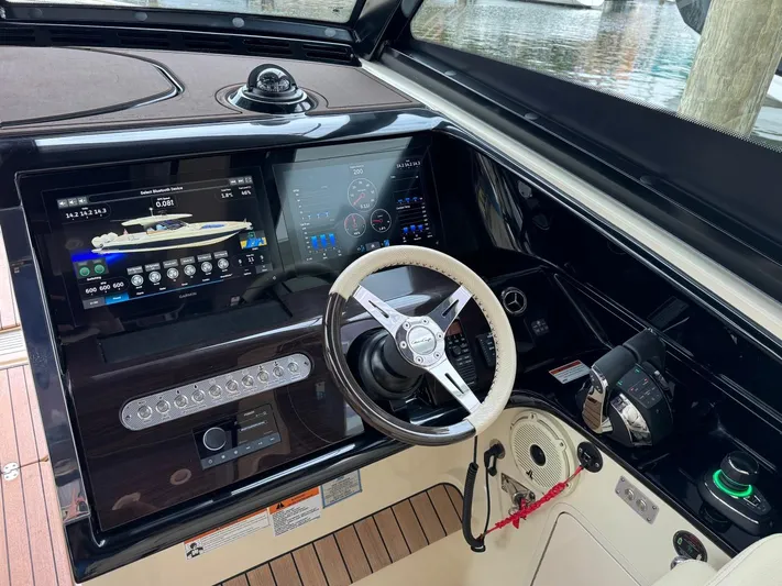  Yacht Photos Pics 2022 Chris-Craft CALYPSO 35 CP helm with modern controls and navigation displays.