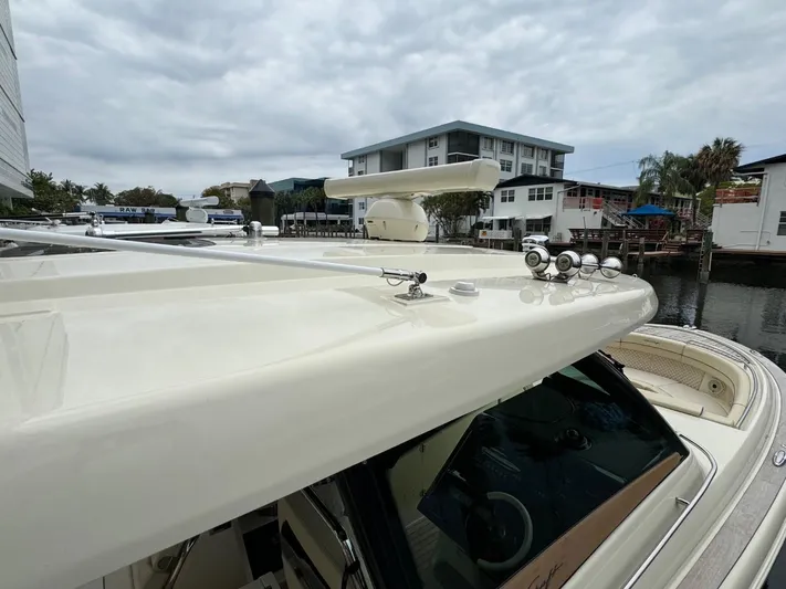  Yacht Photos Pics 2022 Chris-Craft CALYPSO 35 CP boat with radar and lights, docked near waterfront buildings.