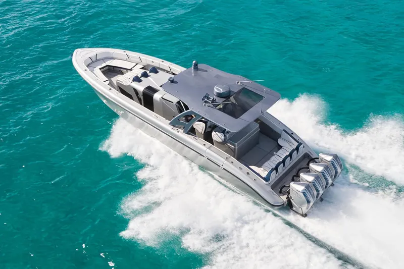  Yacht Photos Pics Luxury Midnight Express 43' Solstice boat cruising on turquoise waters.