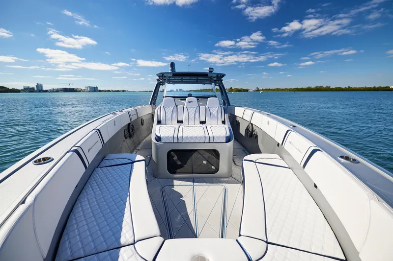  Yacht Photos Pics Luxury Midnight Express 43' Solstice boat interior on calm water under blue sky.