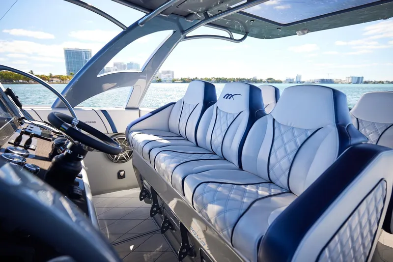  Yacht Photos Pics Luxurious interior of Midnight Express 43' Solstice boat with plush seating and modern controls.