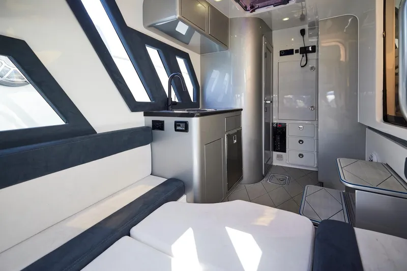  Yacht Photos Pics Luxurious interior of Midnight Express 43' Solstice yacht with modern seating and kitchenette.