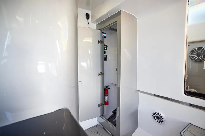  Yacht Photos Pics Interior of Midnight Express 43' Solstice boat, featuring sleek white cabinetry and safety equipment.