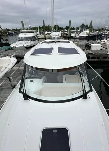 Something Special Yacht Photos Pics 2016 Jeanneau Merry Fisher 855 docked at a marina, showcasing sleek design and spacious deck.