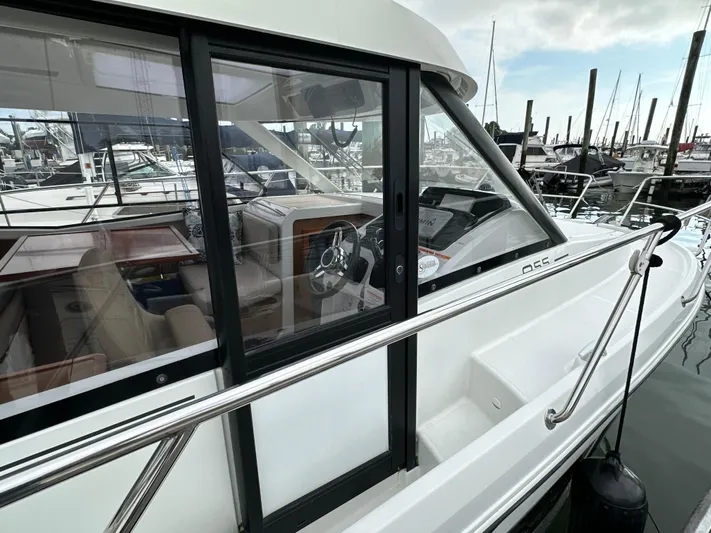 Something Special Yacht Photos Pics 2016 Jeanneau Merry Fisher 855 boat docked at marina, showcasing sleek design and modern features.