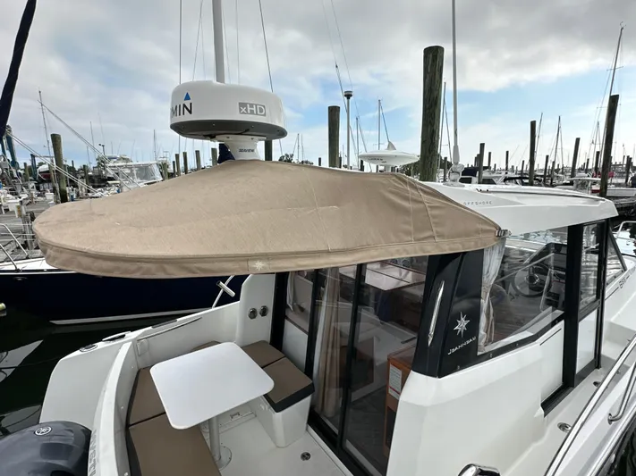 Something Special Yacht Photos Pics 2016 Jeanneau Merry Fisher 855 boat with canopy, docked at marina.
