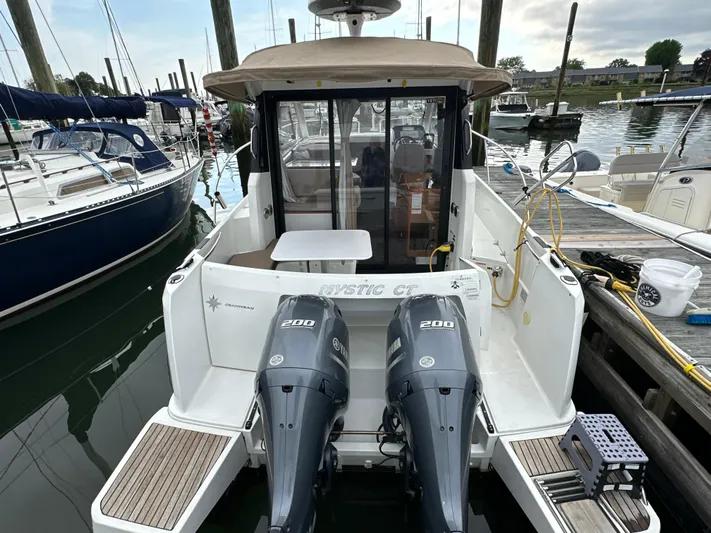 Something Special Yacht Photos Pics 2016 Jeanneau Merry Fisher 855 with twin 200 HP engines docked at marina.