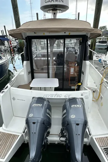 Something Special Yacht Photos Pics 2016 Jeanneau Merry Fisher 855 with twin 200 HP engines docked at marina.