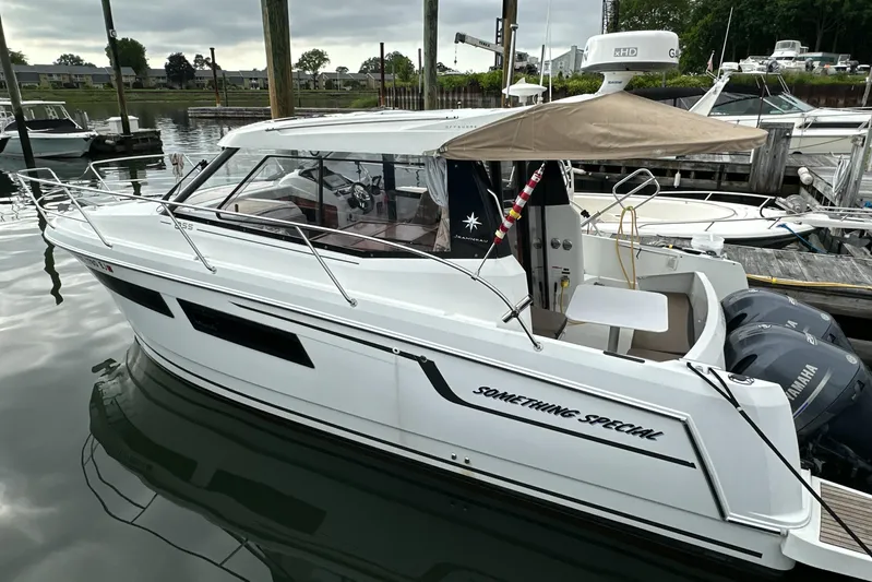 Something Special Yacht Photos Pics 2016 Jeanneau Merry Fisher 855 boat docked, featuring sleek design and Yamaha engines.