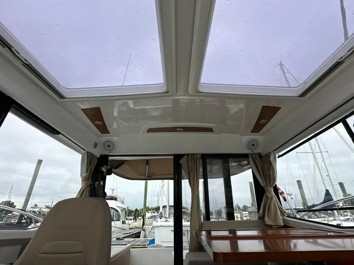 Something Special Yacht Photos Pics Interior view of 2016 Jeanneau Merry Fisher 855 with skylights and seating area.