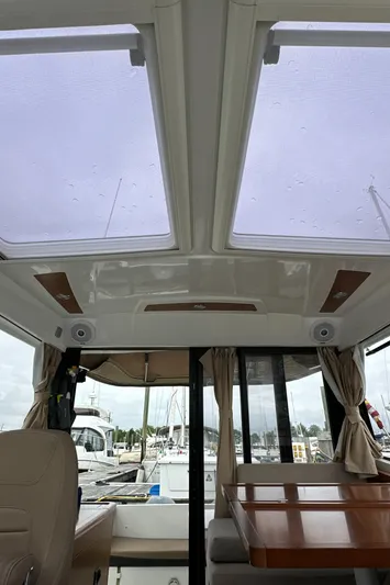Something Special Yacht Photos Pics Interior view of 2016 Jeanneau Merry Fisher 855 boat with skylights and seating area.